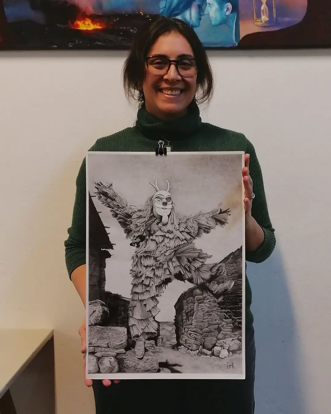 Gabriela posing with a piece of art of her own